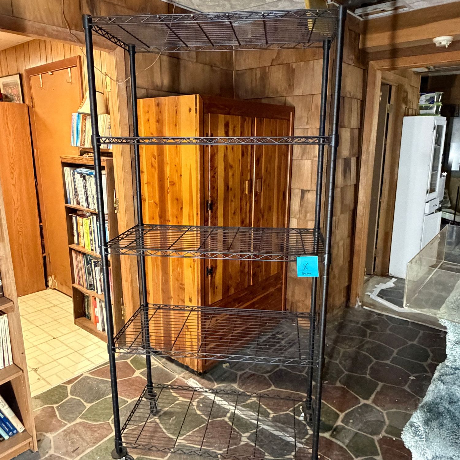 Black industrial shelf (X) on casters, 6'3"H x 21"W x 38"L