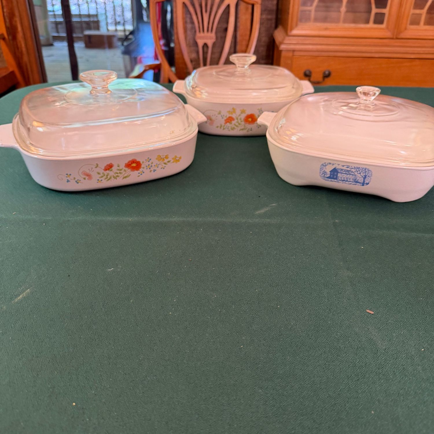 Trio of vintage casseroles with lids, Corningware wildflower (largest is 9 Trio of vintage casseroles with lids, Corningware wildflower (largest is 9"), and Radarange, B0676