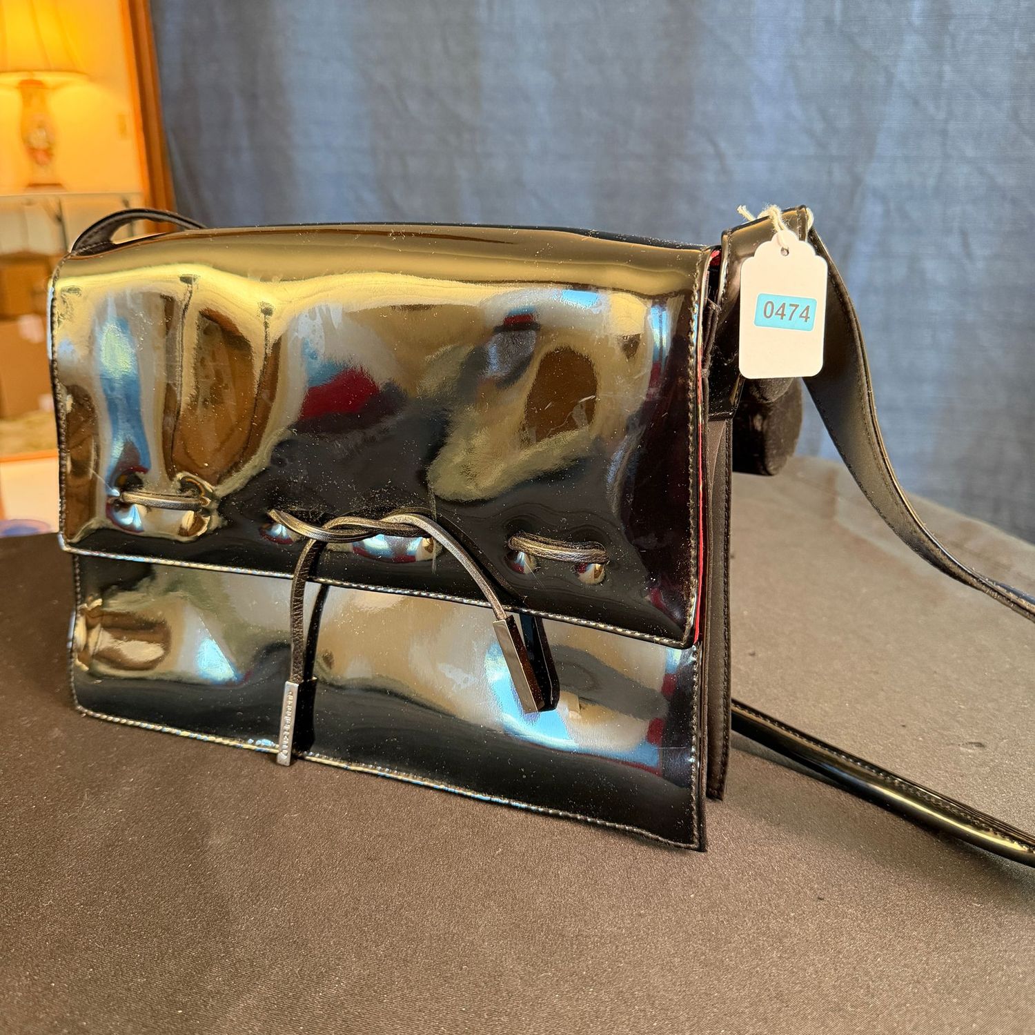 Black Liz Claiborne patent leather purse with polka dot lining, 10", B0474