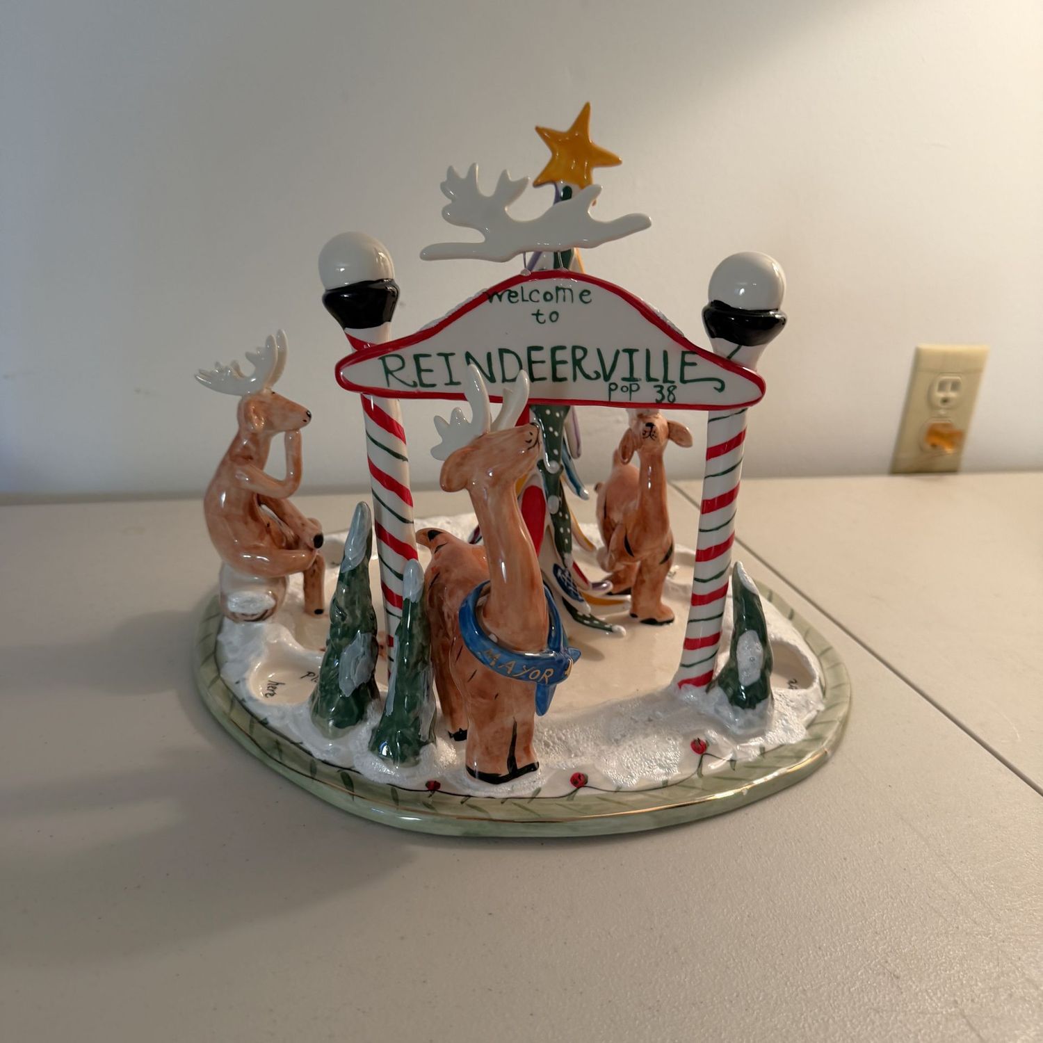Blue Sky Welcome to Reindeerville 13 Blue Sky Welcome to Reindeerville 13"W scene, one reindeer antler has been glue repaired