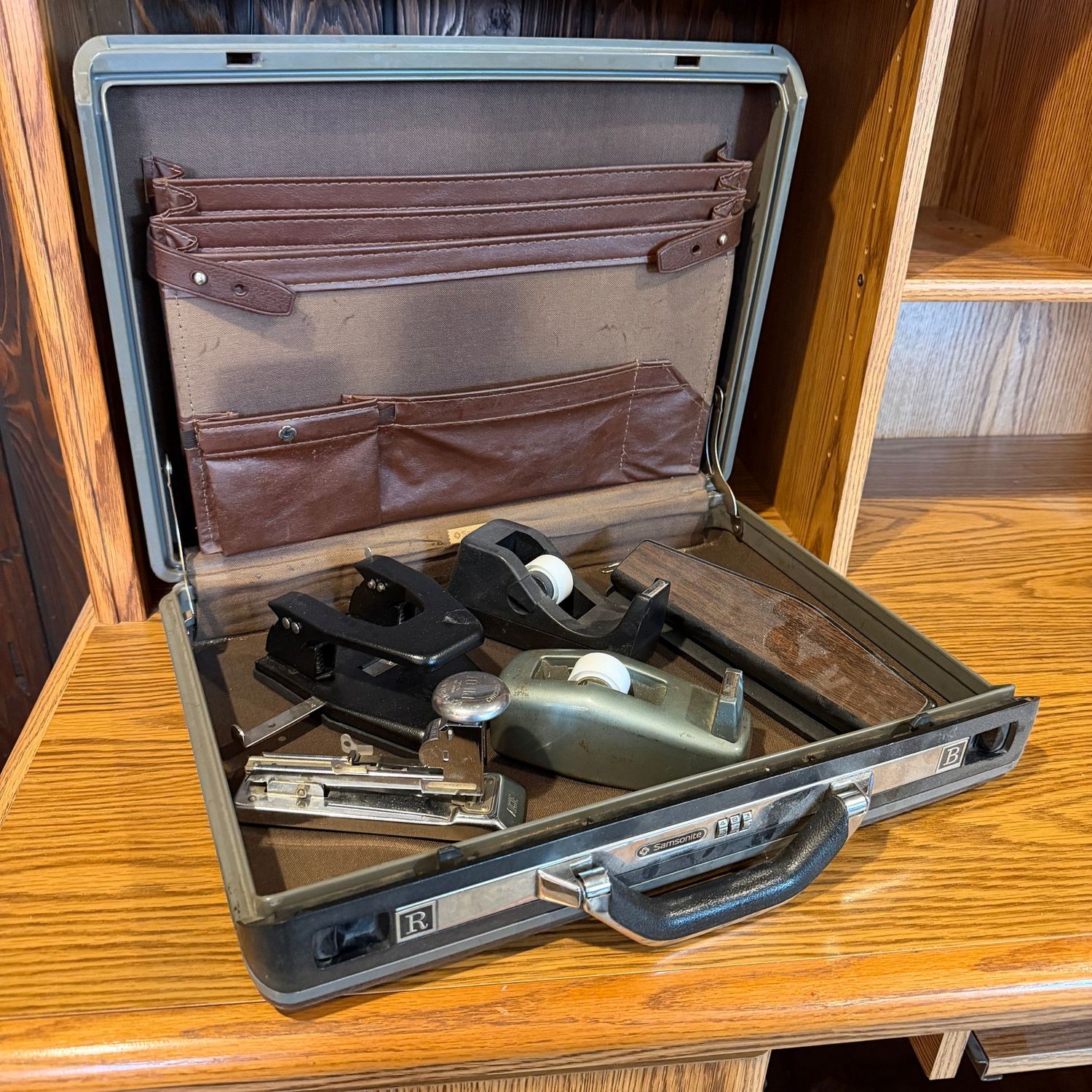 Plastic briefcase with vintage desk supplies
