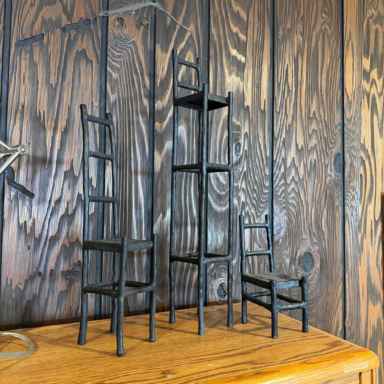 Tall, slender cast iron ladder chair decorations, the tallest is 19"