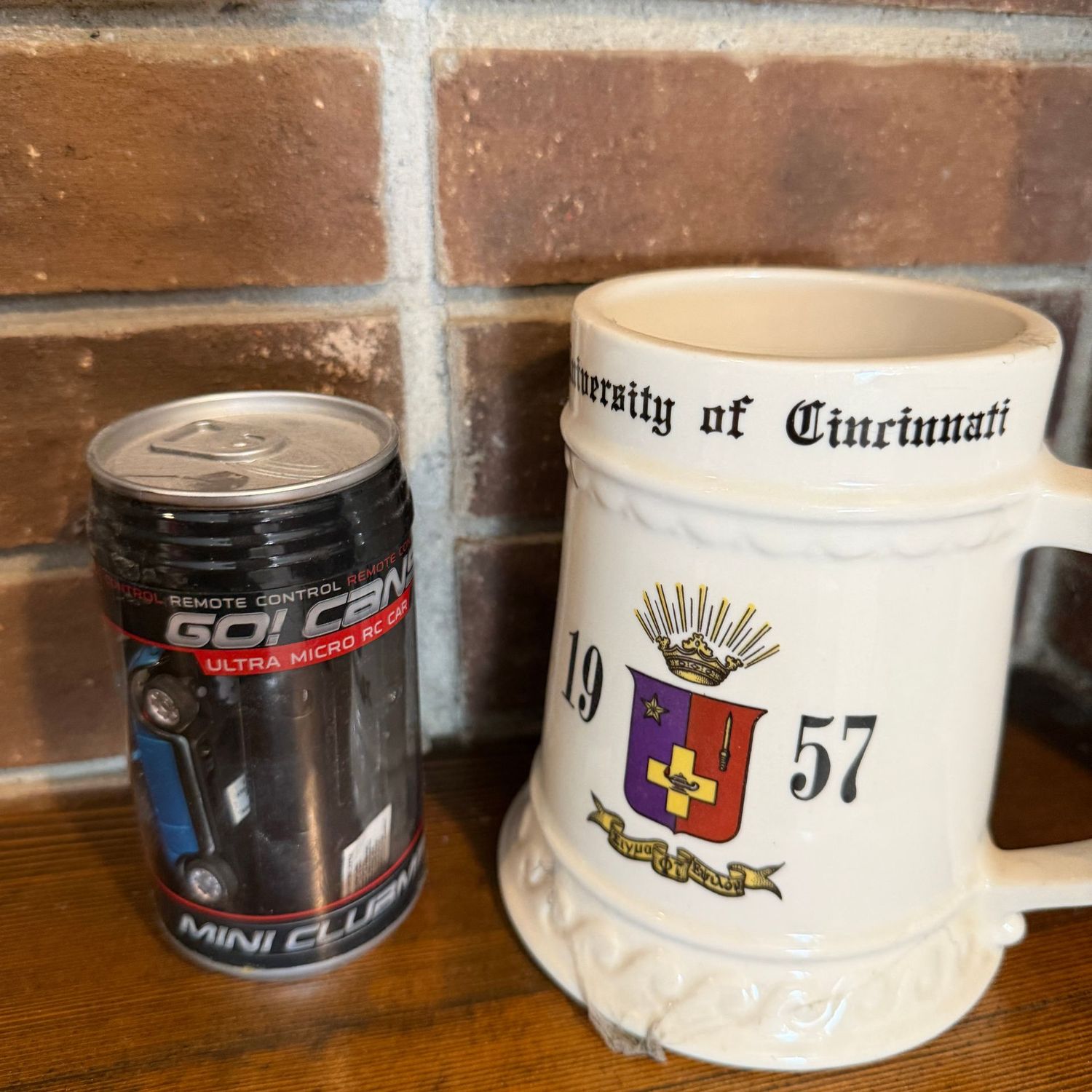 University of Cincinnati mug and car can