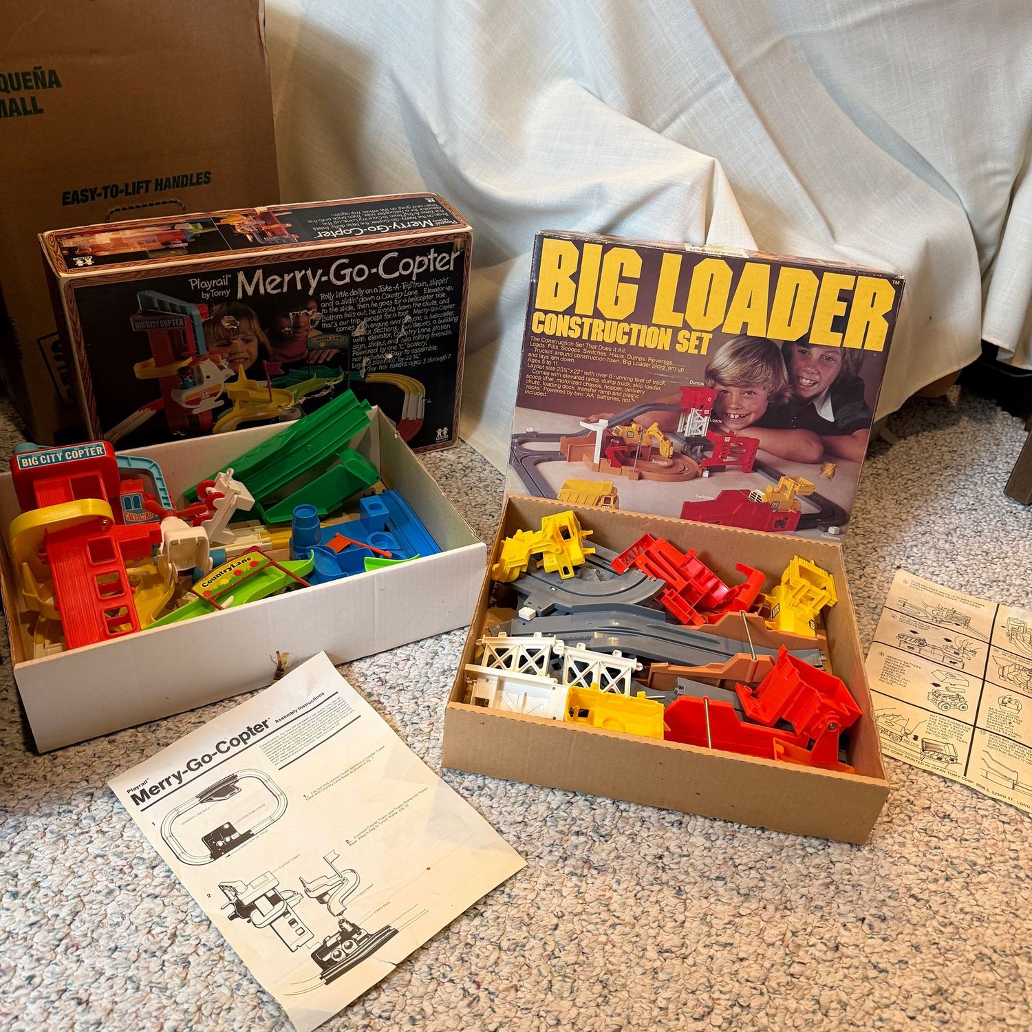Merry-Go-Copter, and Big Loader game sets, with pieces seen