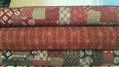 Japanese Cotton print fabric by Sevenberry. Patchwork design print in reds, cream and maroon.