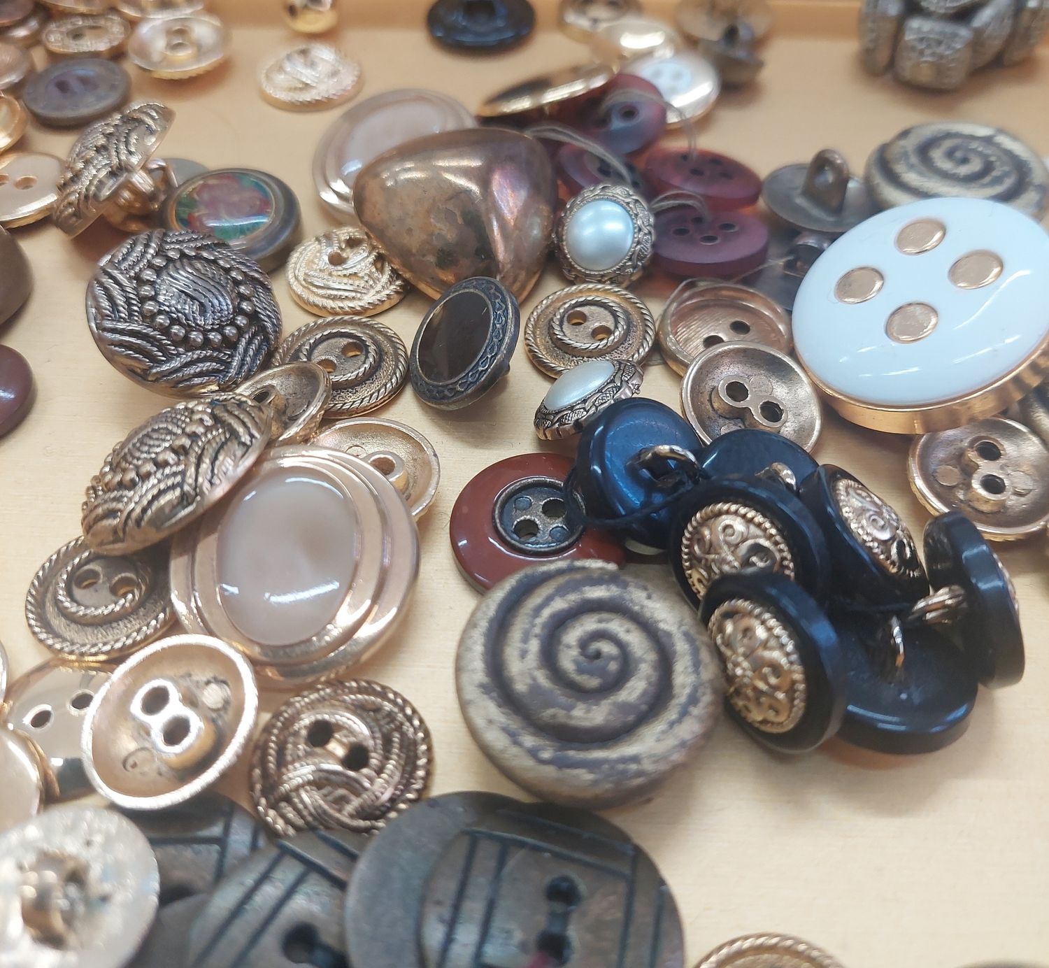 A collection of interesting vintage  buttons at Material moves design and dressmaking studio