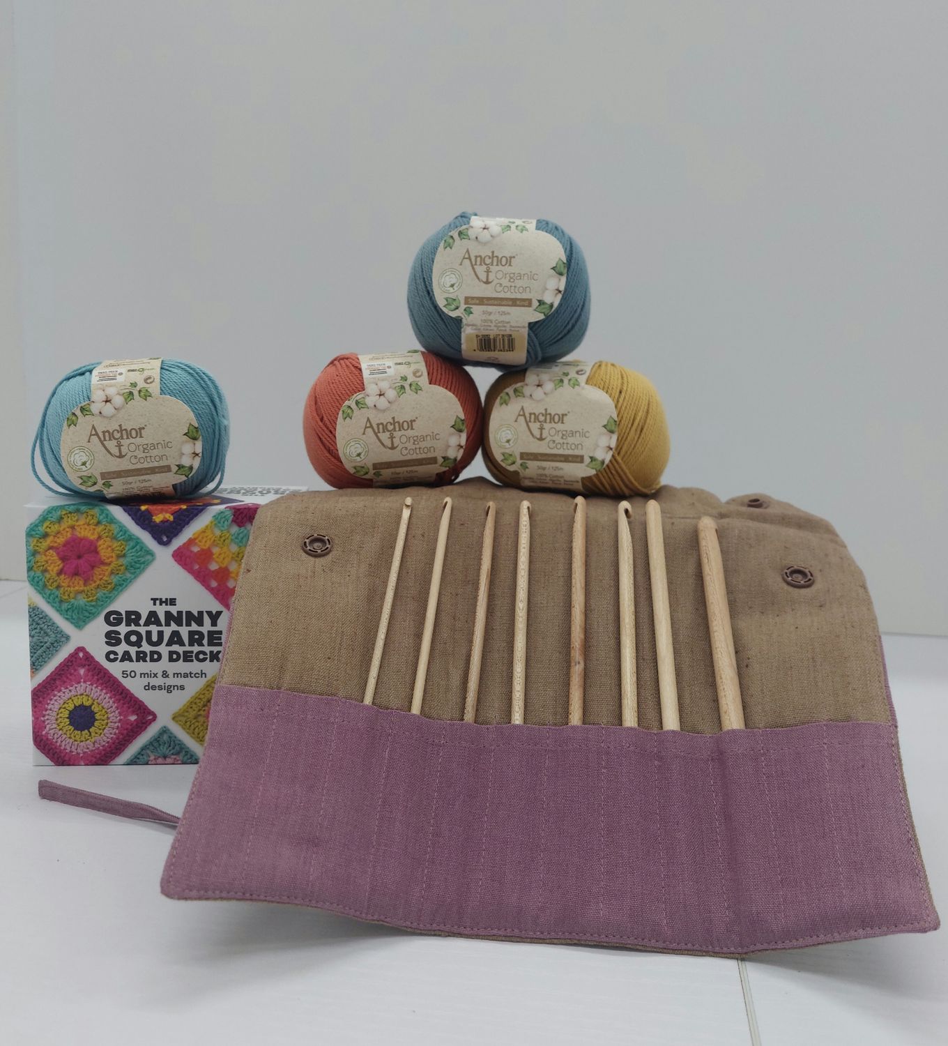 Crochet kit with Maple hooks, organic cotton yarn, and Granny Square card deck. Crochet kit with Maple hooks, organic cotton yarn, and Granny Square card deck.
