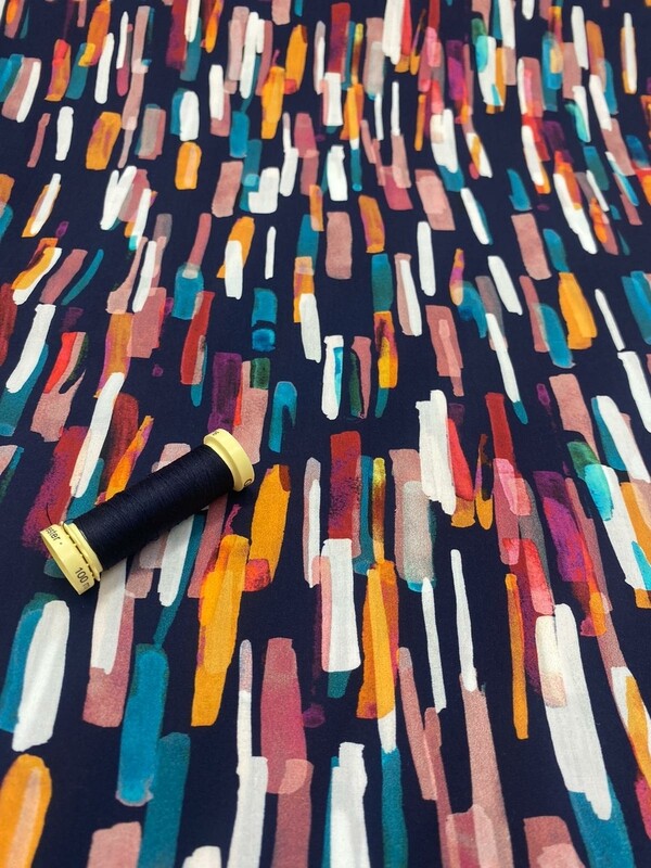 Dress fabric 100% Oeko-Tex Giza Cotton. Vibrant brushstrokes design on navy ground Dress fabric 100% Oeko-Tex Giza Cotton. Vibrant brushstrokes design on navy ground