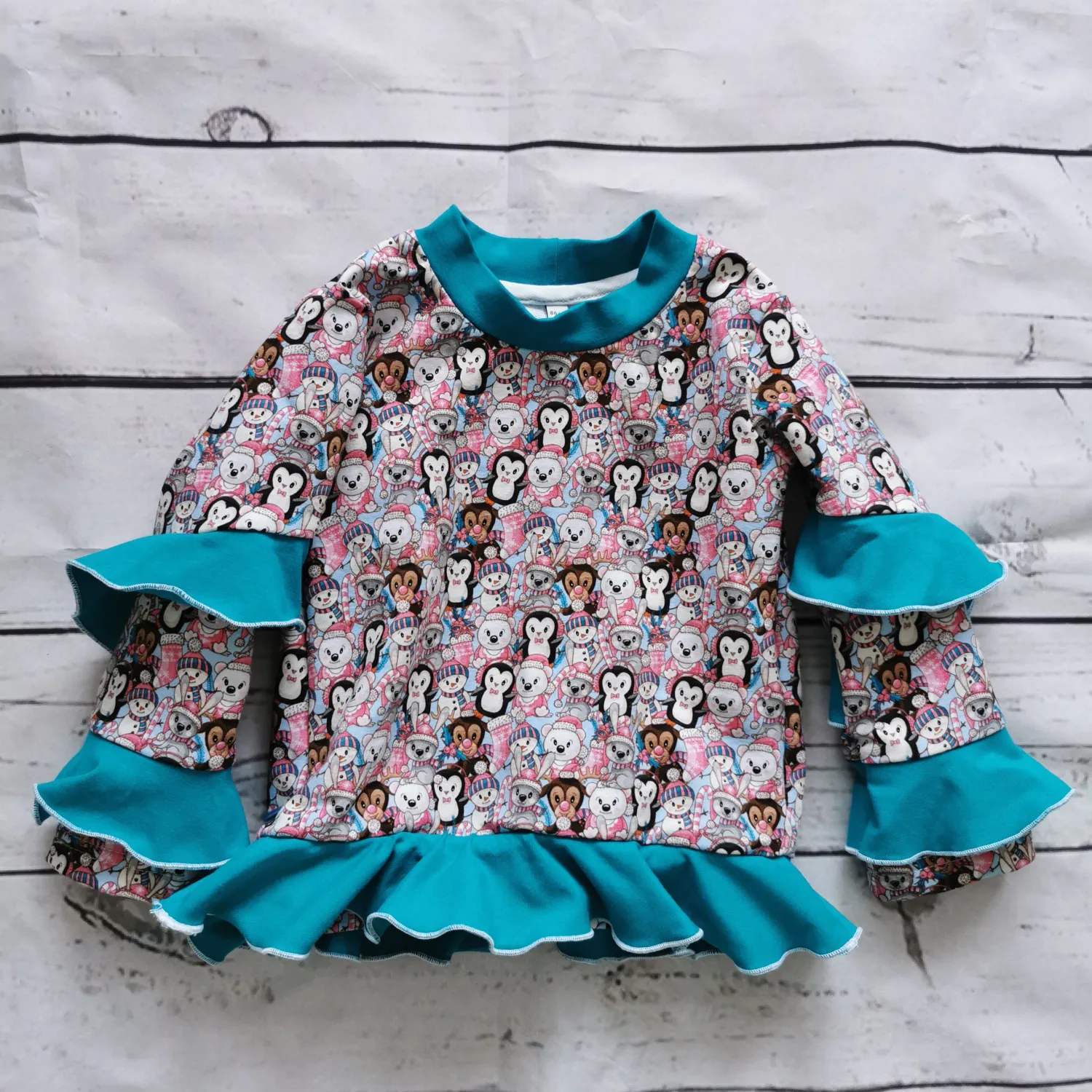 Pullover "Wintertiere" mit Rüschen Gr. 86/92