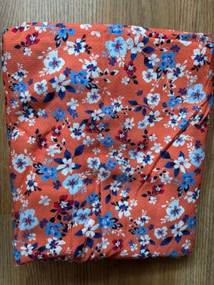 1,50m Viskose Webware orange mit Blumen 1,50m Viskose Webware orange mit Blumen