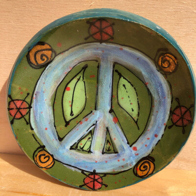 Pale Blue Peace Sign With Green Leaves