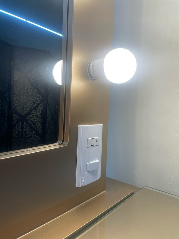 Gold makeup vanity with power outlet
