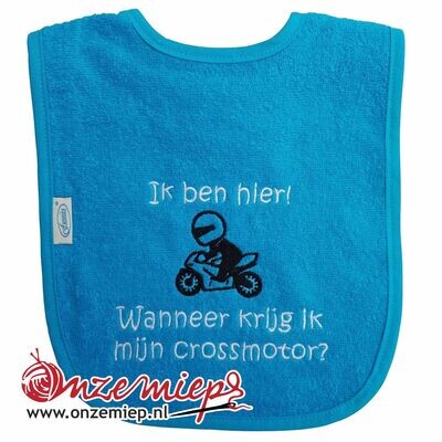 Turquoise slab met &quot;Ik ben hier! Wanneer krijg ik mijn crossmotor?&quot;