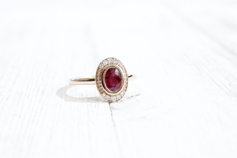 14kr .85ct Total Gem &amp; Diamond Weight Oval Bezel Set Ruby &amp; Diamond Halo, Ruby at .76ct &amp; 10 Diamonds at .09ct Total 