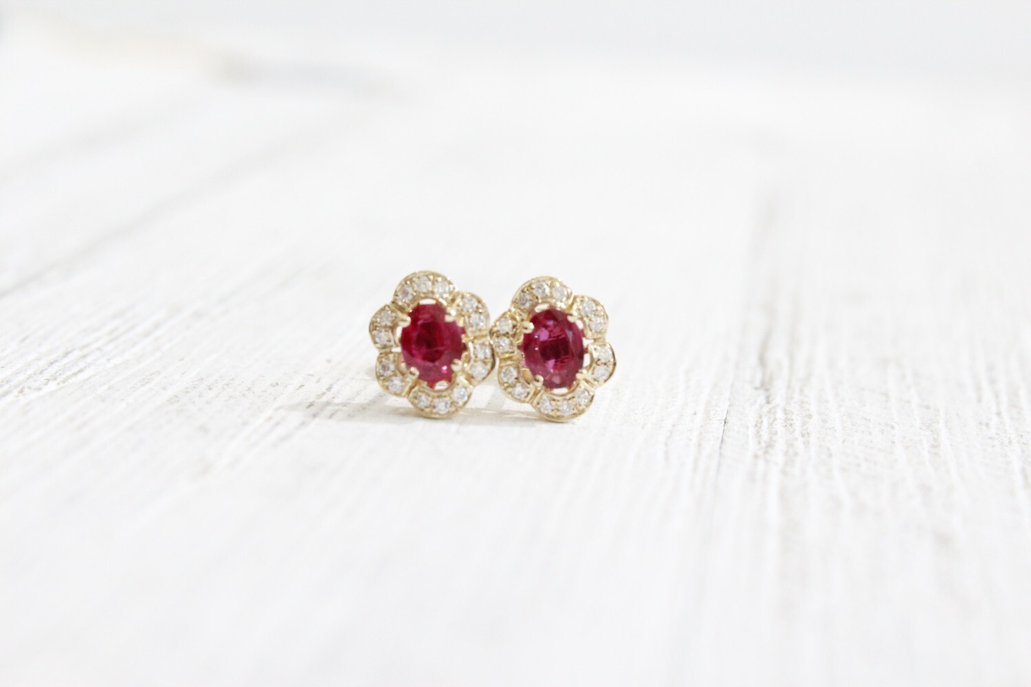 14ky .73ct Total Oval Ruby with Fancy Diamond Halo Earrings, 2 Rubies at .63ct Total &amp; 28 Round Diamonds at .10ct Total