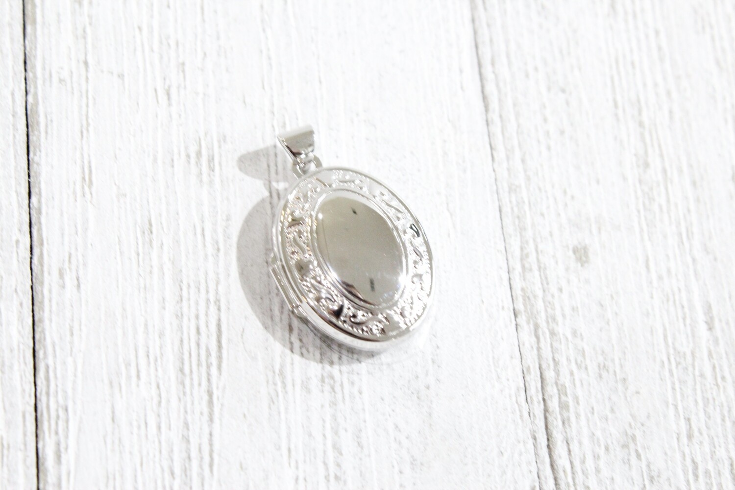 Sterling Silver 21mm Heart Border Oval Locket