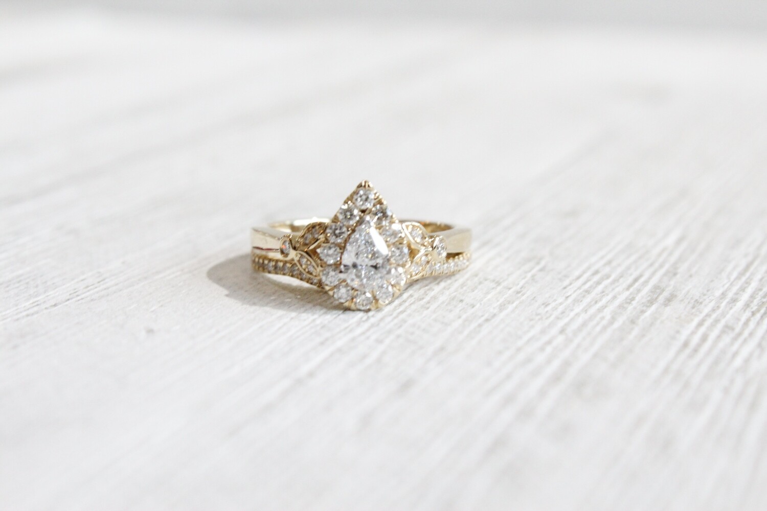 14ky .77ct Total Pear Halo with Leaf Design on Shank and Matching Curved Band, 1 at .31ct &amp; 53 at .46ct Total 