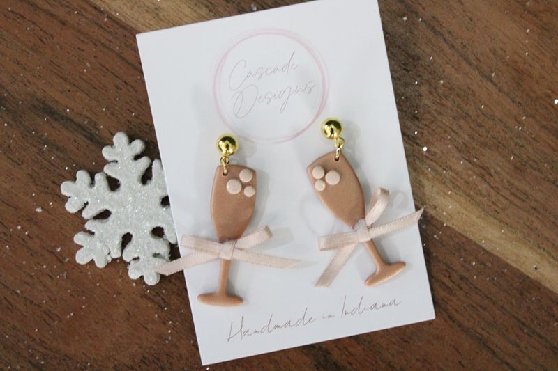 The Fizzi Champagne Glass Clay Earrings (Black Bow)