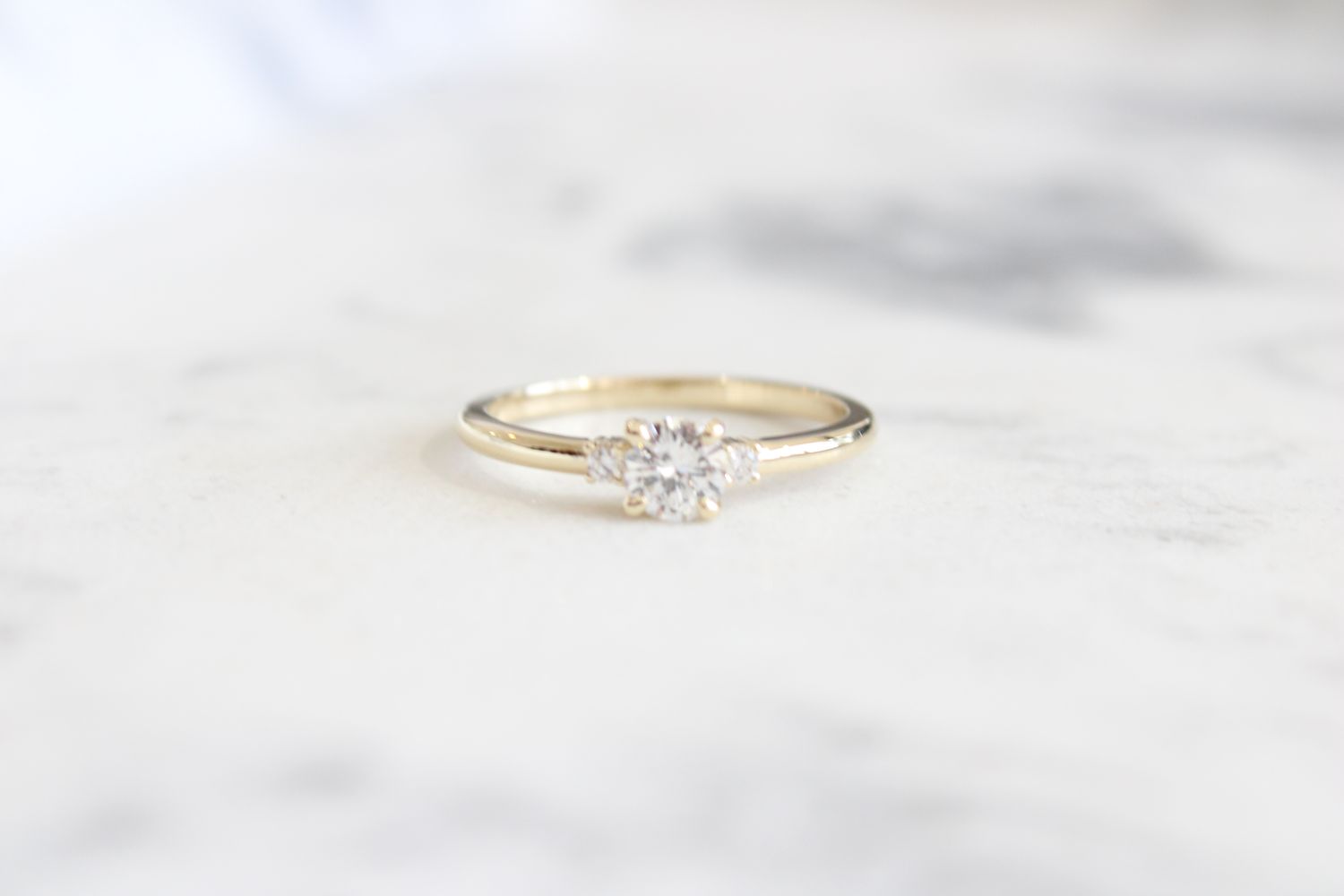 14kt Yellow Gold 1/2ct Diamond, 1/3ct Center Round Diamond, 3 Stone Ring