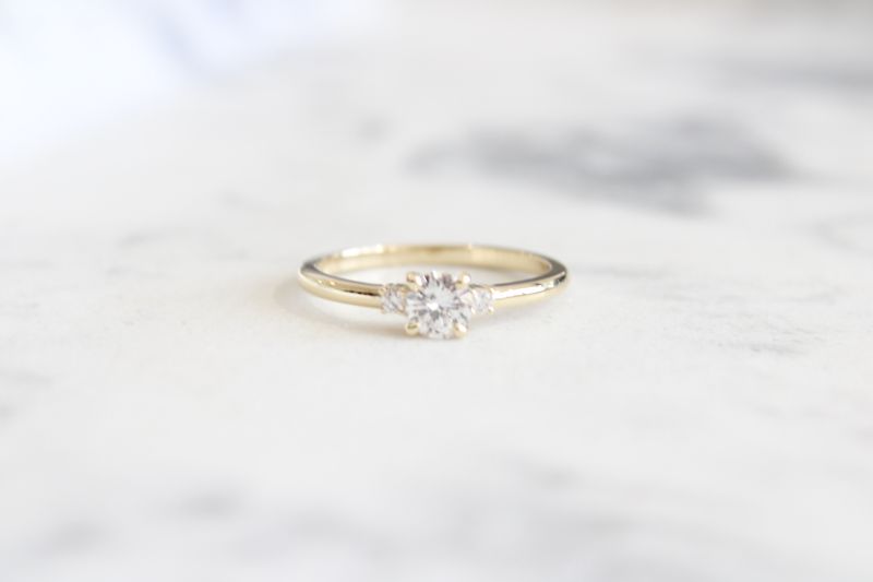 14kt Yellow Gold 1/2ct Diamond, 1/3ct Center Round Diamond, 3 Stone Ring