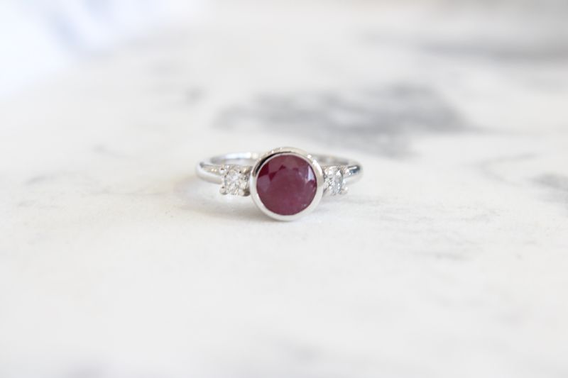 10kt White Gold 7mm Bezel Set Ruby with Diamond Side 3 Stone Ring