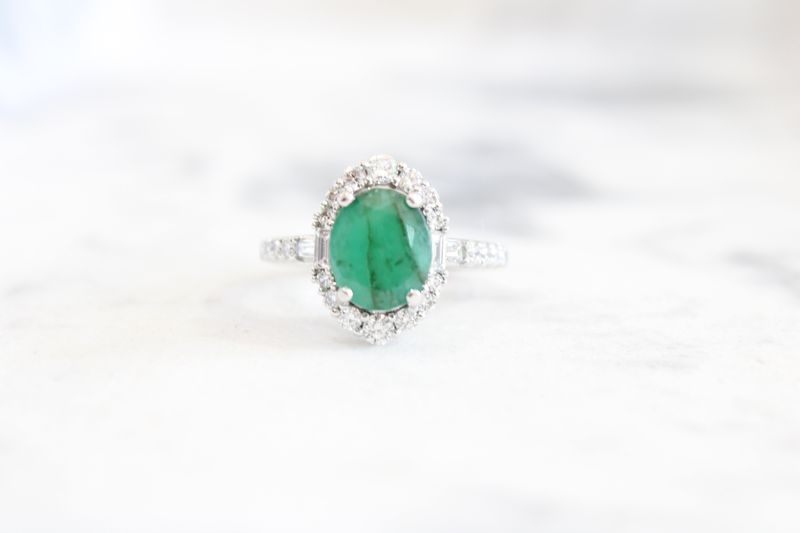 18kt White Gold 2.68ct Vintage Diamond Halo and Oval Emerald Ring, 2ct Oval, 4 Baguette at .18ct, 22 Round at .50ct