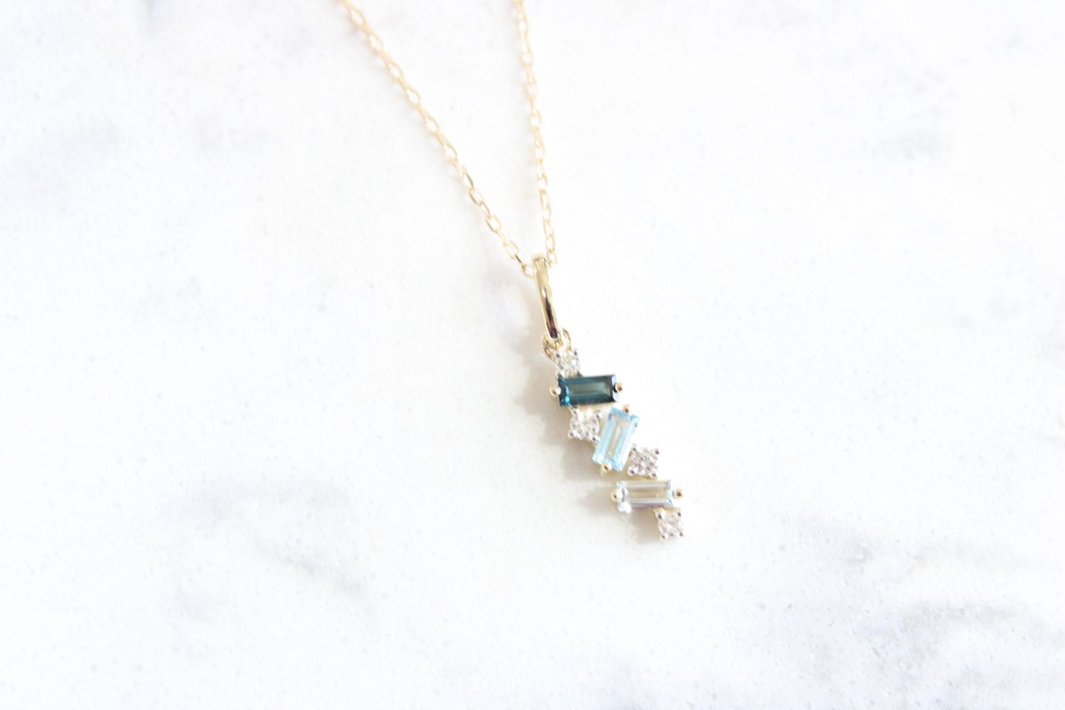 Blue Topaz Ombre Pendant .10td 10K yellow gold