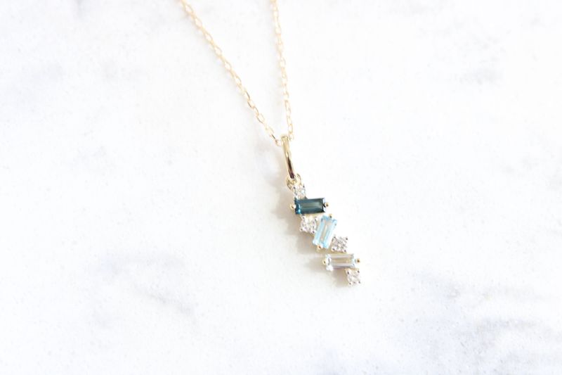 Blue Topaz Ombre Pendant .10td 10K yellow gold