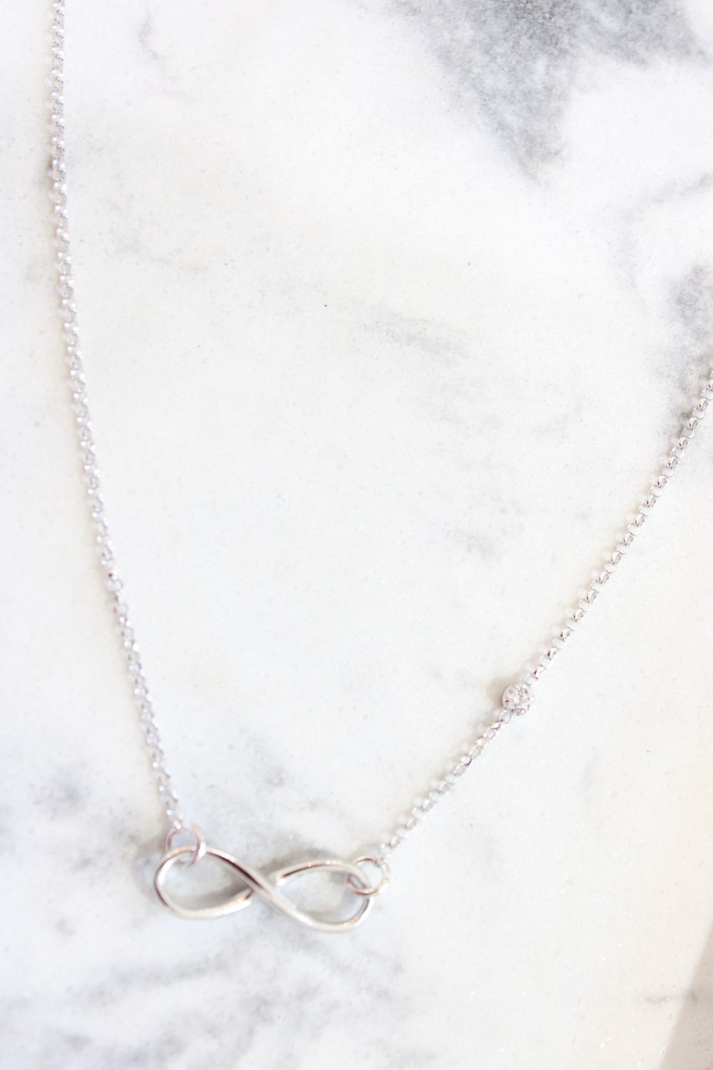 Sterling Silver Rhodium-plated CZ Infinity Knot Necklace