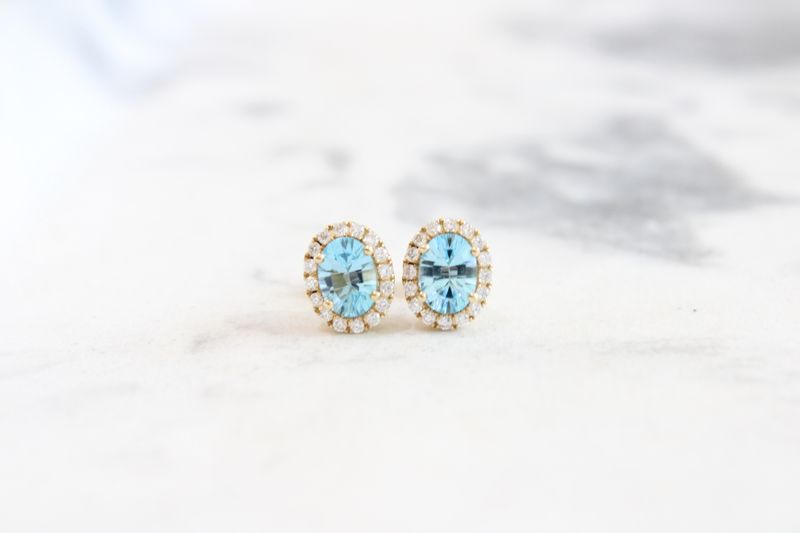14K Blue Topaz 1.81CT with 32 brilliant 38CT diamond Halo 