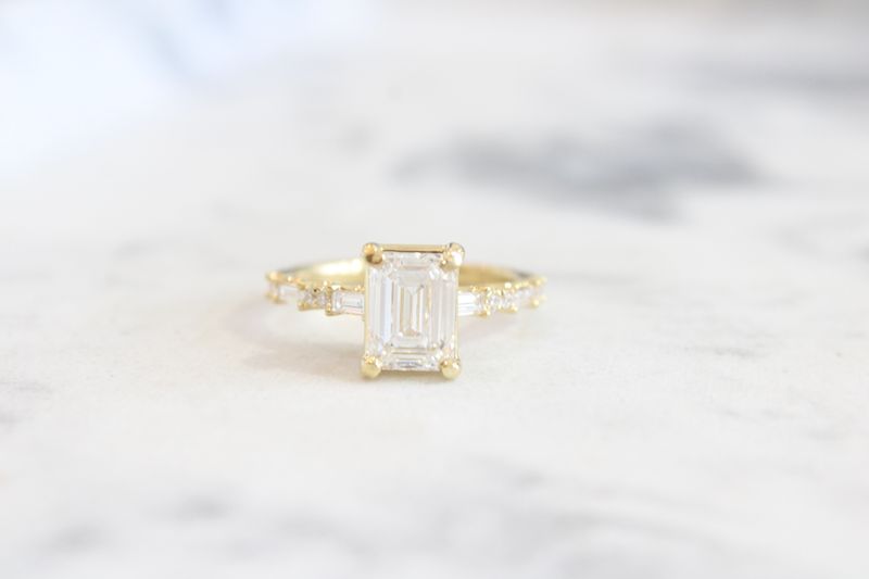 18kyg 2.29ct, 1.91ct Center Lab Grown Emerald Cut, with Round and Baguette Diamond Shank Engagement Ring