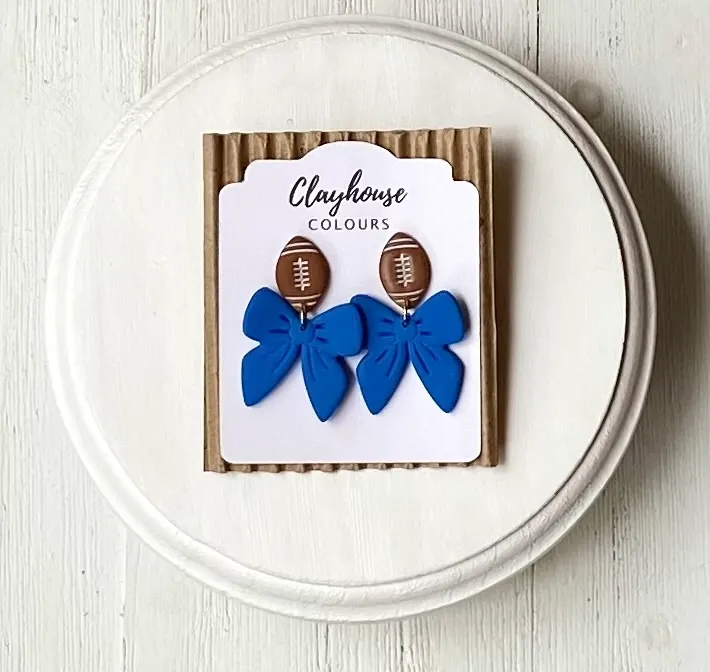 Blue Football & Bow Clay Earrings Blue Football & Bow Clay Earrings