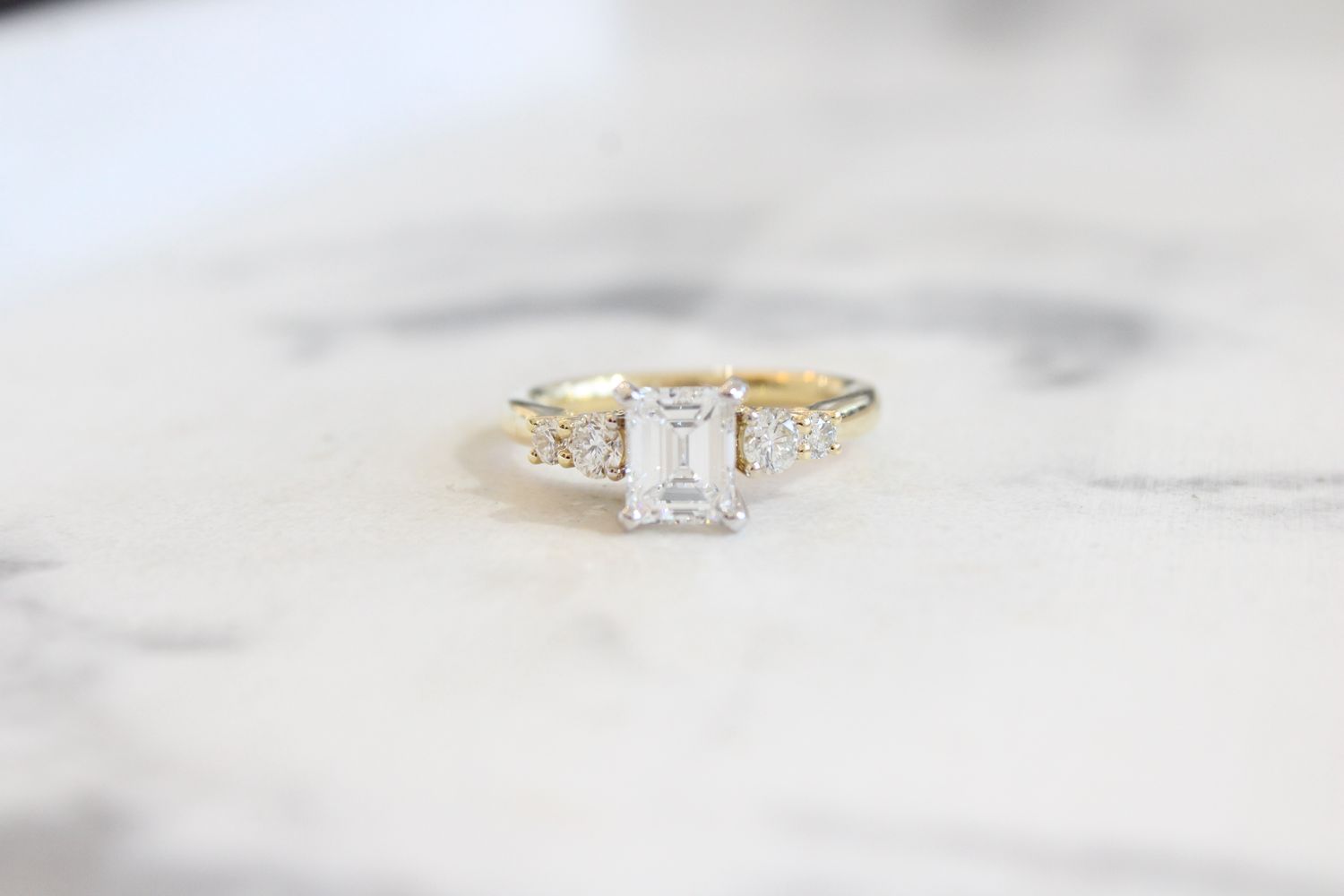 18kt Yellow Gold 1.53ct, 1.02ct Emerald Cut Diamond, 5 Diamond Ring 18kt Yellow Gold 1.53ct, 1.02ct Emerald Cut Diamond, 5 Diamond Ring