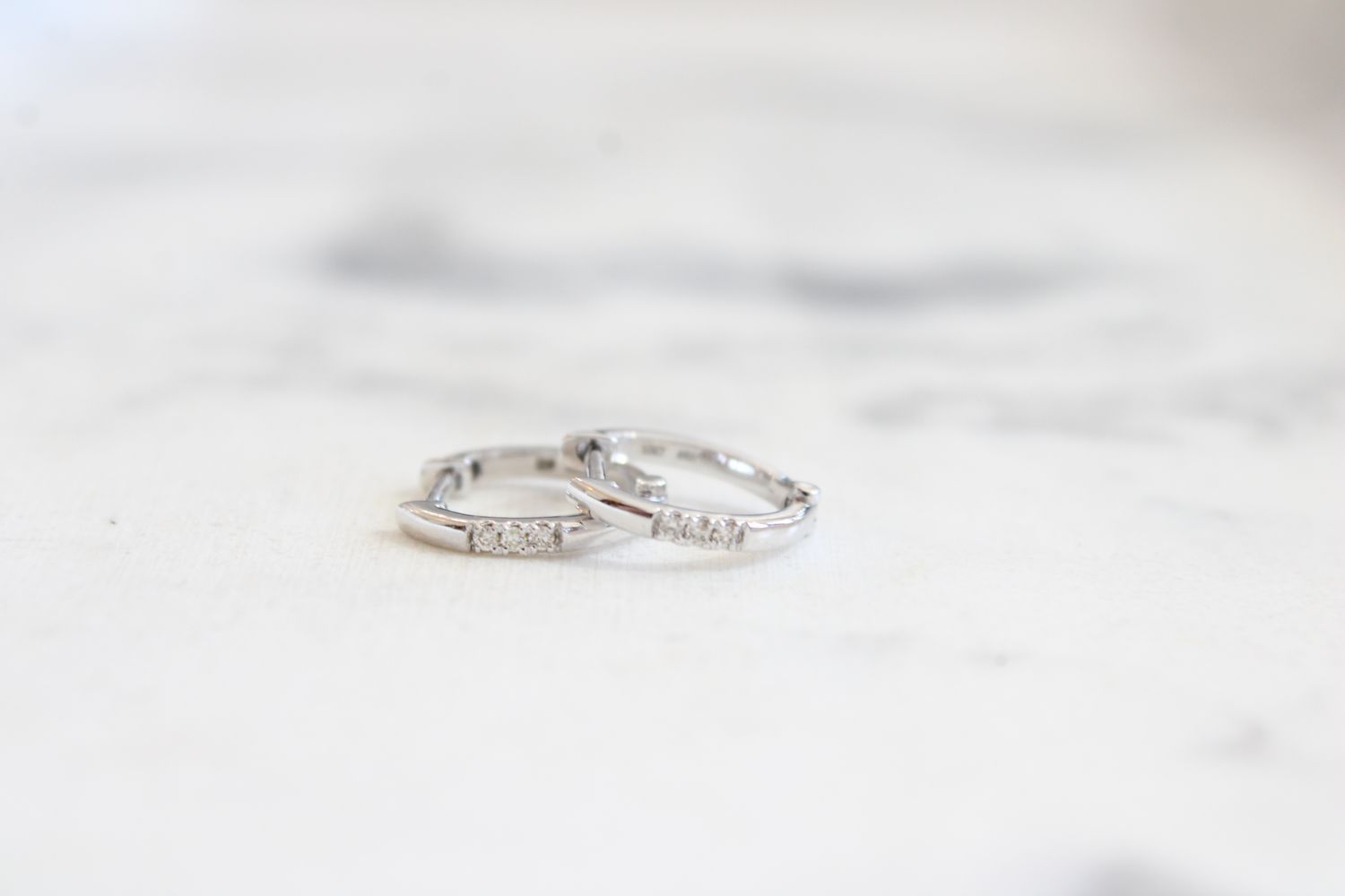 10K White Gold Diamond Huggie Hoops .04ctw 10K White Gold Diamond Huggie Hoops .04ctw