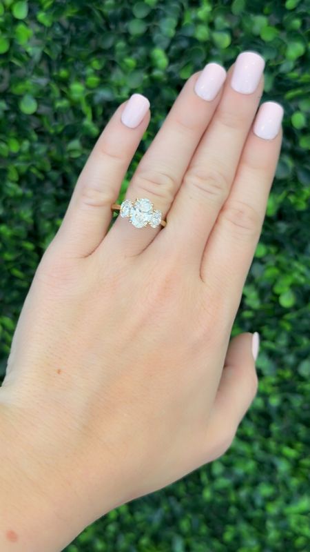 14K Yellow Gold Lab Grown 2.07ct Oval Center Diamond Surrounded with .96ctw Diamonds on each Side 14K Yellow Gold Lab Grown 2.07ct Oval Center Diamond Surrounded with .96ctw Diamonds on each Side