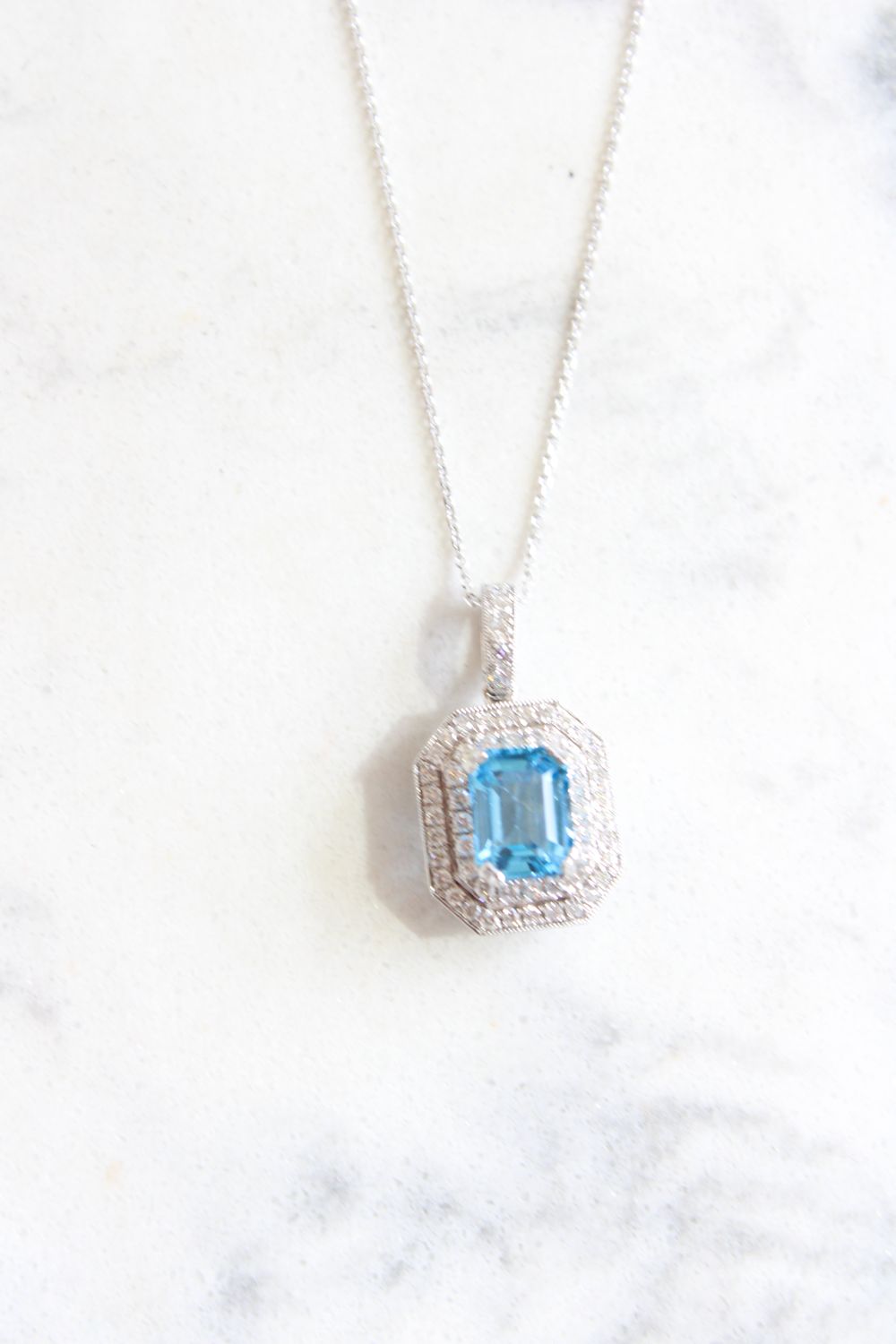 14k White Gold Emerald Cut Blue Topaz with Double Halo diamonds 14k White Gold Emerald Cut Blue Topaz with Double Halo diamonds