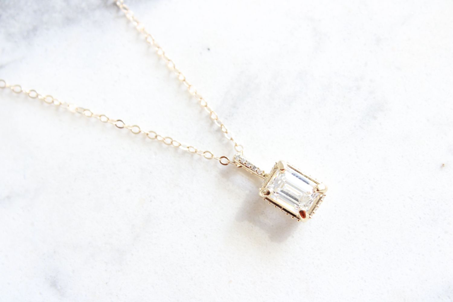 14kt Yellow Gold 1.26ct Emerald Cut Lab Grown Diamond in .06ct Genuine Diamond Accented Necklace 14kt Yellow Gold 1.26ct Emerald Cut Lab Grown Diamond in .06ct Genuine Diamond Accented Necklace
