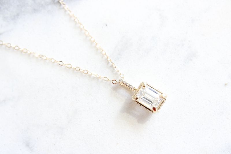 14kt Yellow Gold 1.26ct Emerald Cut Lab Grown Diamond in .06ct Genuine Diamond Accented Necklace 14kt Yellow Gold 1.26ct Emerald Cut Lab Grown Diamond in .06ct Genuine Diamond Accented Necklace