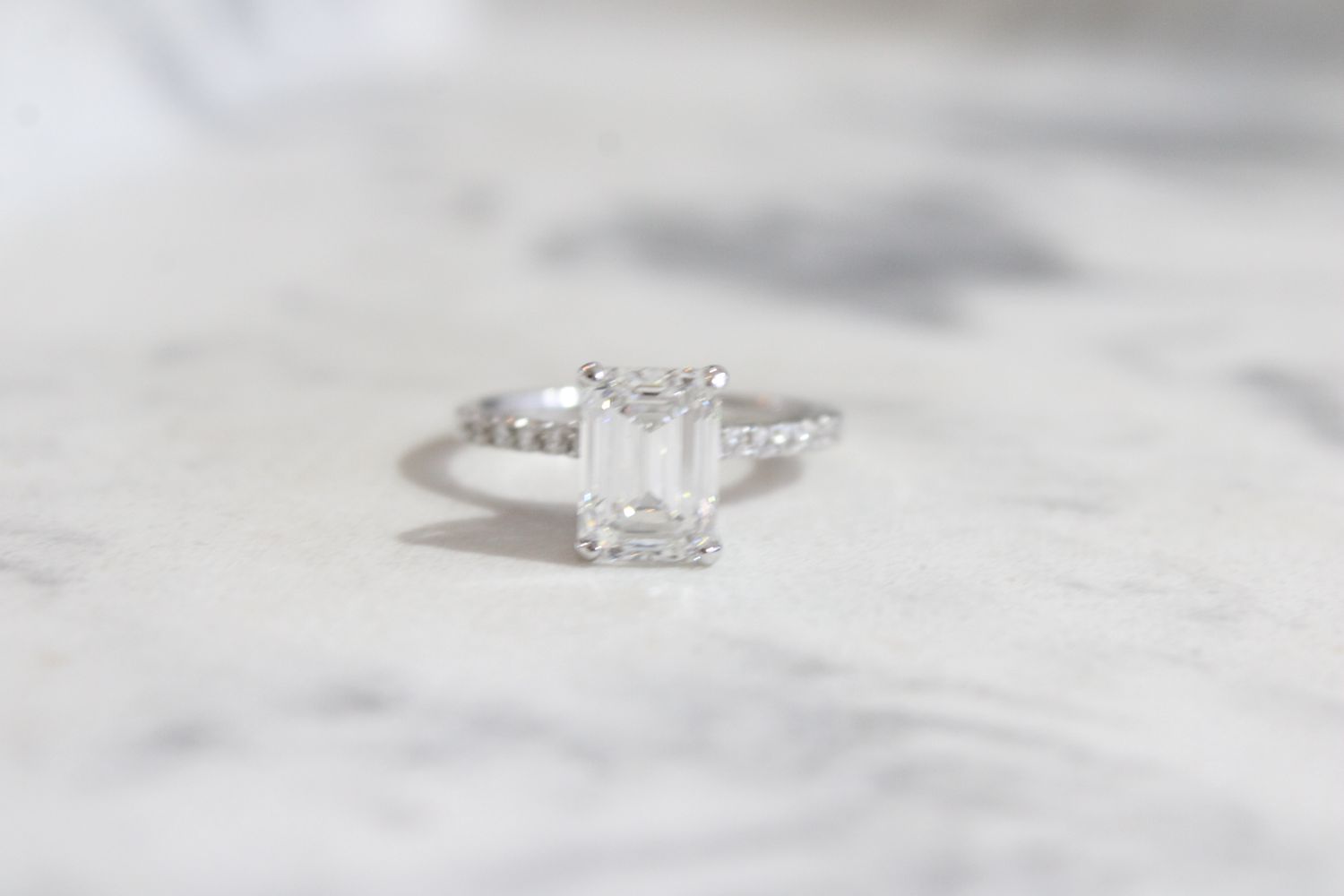 14kw 2.52ct Emerald Cut Lab Grown Diamond Center with Diamond Shank Ring, 12 at .19ct Total 14kw 2.52ct Emerald Cut Lab Grown Diamond Center with Diamond Shank Ring, 12 at .19ct Total