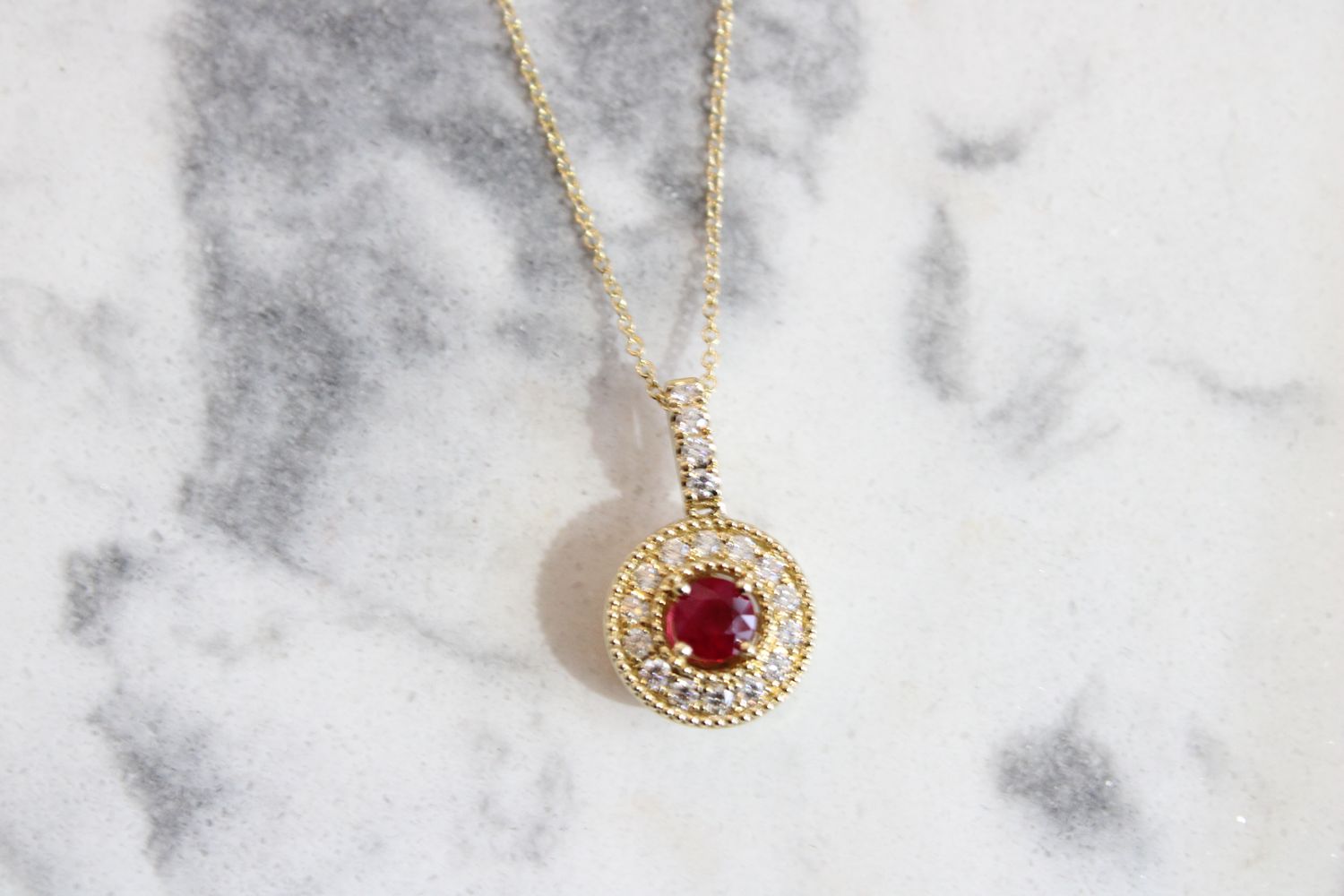14K Yellow Gold Ruby .41ct surrounded by 18 Brilliant .30ct Diamond Pendant 14K Yellow Gold Ruby .41ct surrounded by 18 Brilliant .30ct Diamond Pendant