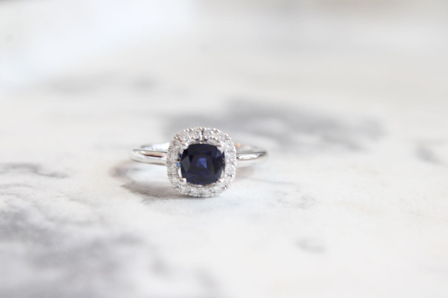 14k White Gold 1.09ct Sapphire Surrounded by 16 Brilliant .20ct Diamond Ring 14k White Gold 1.09ct Sapphire Surrounded by 16 Brilliant .20ct Diamond Ring