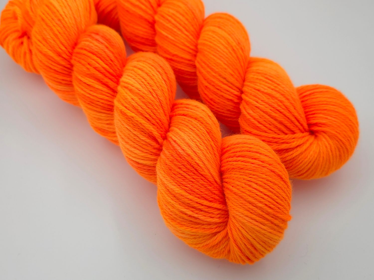 Orange Zing Ladybug on Organic Merino 225m/100g