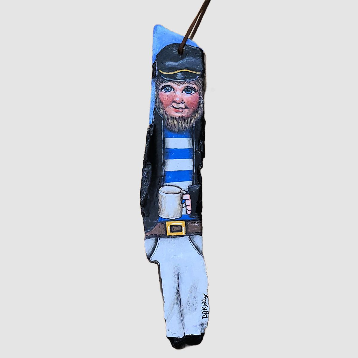 A sea faring man painted on driftwood by D. J. Kelly