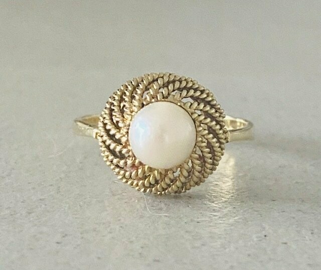 Golden ring with pearl