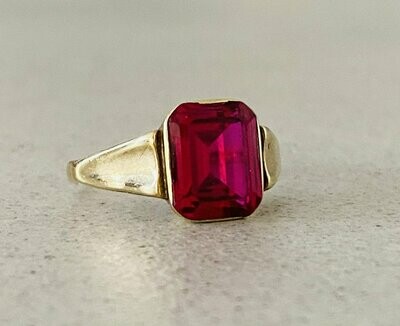 Ruby red golden ring