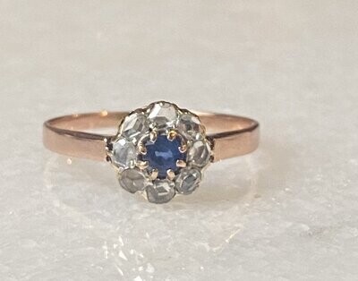 Ring with blue sapphire and rose diamonds
