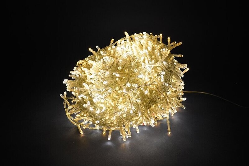 SERIE LUCI 300LED 8 FUNZIONI - USO ESTERNO - BIANCO CALDO - FILO TRASP.