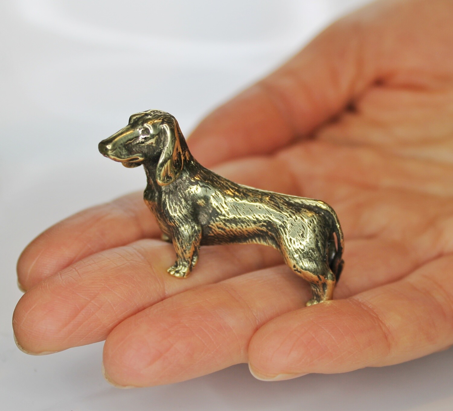 Details about   Solid Brass Amber Figurine of lazy Dachshund on a pillow Dog IronWork 
