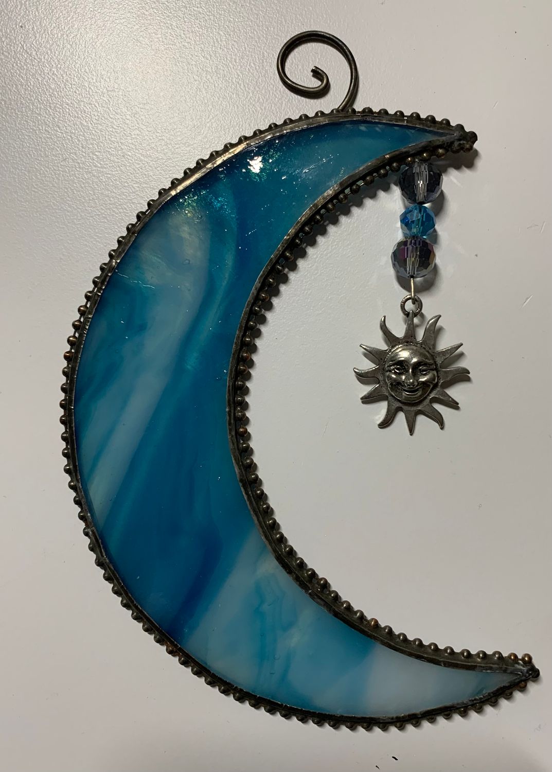 Moon with sun charm
