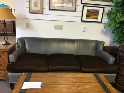 Blue leather modern couch with brown cushions